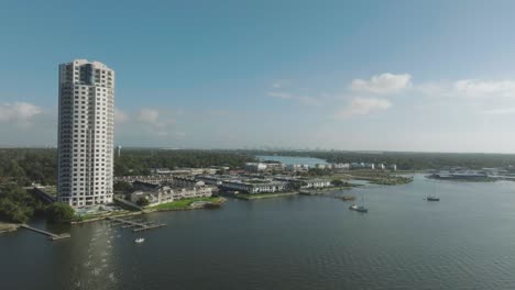 An-aerial-establishing-shot-of-the-Endeavour-high-rise,-a-luxurious-30-story-modern-high-rise-building-located-in-Seabrook,-TX,-with-unparalleled-views-of-the-Clear-Lake-area-and-the-Houston-skyline