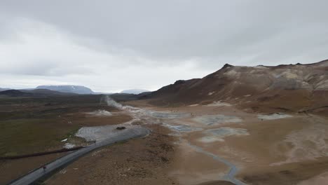 Drone-captures-the-alien-beauty-of-Mývatn's-geothermal-salts,-a-stark,-moon-like-terrain-brought-to-life-in-crisp-4K