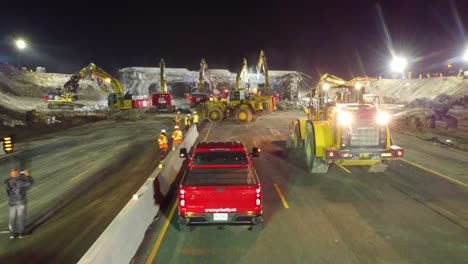 Aerial-Dolly-in-Shot-Construction-Workers-and-Machinery-Dismantle-the-Sunnidale-Overpass