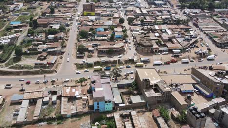 Traffic-in-center-of-African-town-Loitokitok,-Kenya,-aerial-time-lapse