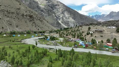 Aerial-View-Of-Basho-Valley-And-Indus-River-In-Skardu-With-Camping-Tents-On-The-Ground