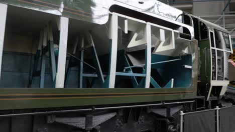 Panning-shot-of-a-cut-open-locomotive-at-the-National-Railway-Museum-In-York