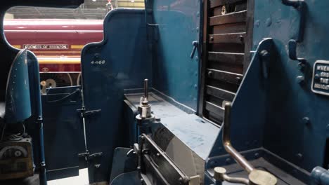 panning-interior-shot-of-a-steam-train-cabin-in-The-National-Railway-Museum-In-York