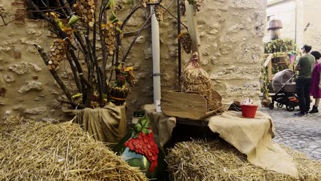 Grape-harvest-festival-of-medieval-Penna-in-Teverina-town-with-decorated-houses-and-streets,-Italy