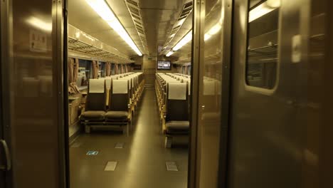 revealing-shot-of-an-antique-interior-of-a-train-in-The-National-Railway-Museum-In-York