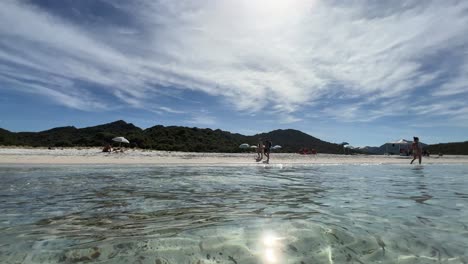 Low-angle-sea-water-surface-point-of-view-of-Lotu-beach-in-summer-season,-Corsica-island-in-France