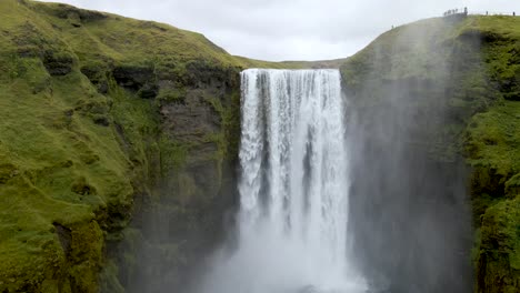 Experience-Skógafoss-Waterfall-from-above-with-our-4K-drone-footage,-highlighting-Iceland's-epic-scenery