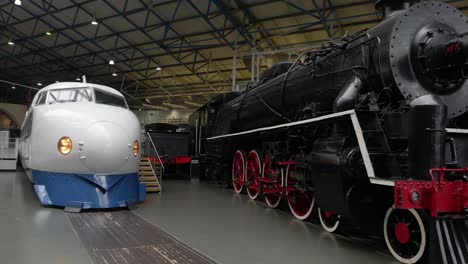 panning-shot-of-a-large-collection-of-trains-at-The-National-Railway-Museum-In-York