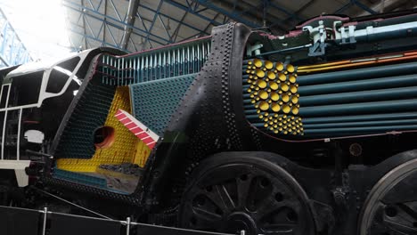 panning-shot-of-the-pipes-within-a-locomotive-at-The-National-Railway-Museum-In-York