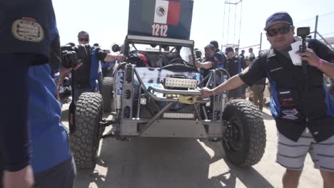 Mexican-score-car-arriving-at-Baja-500-rally-raid-race-at-day-time