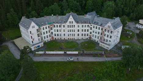 On-hillside-in-Norway,-overlooking-a-beautiful-fjord,-Luster-Sanatorium