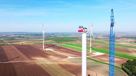 Wind-Farm-With-Wind-Turbine-Under-Construction---aerial-drone-shot
