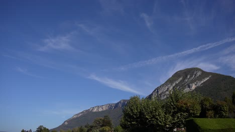 Mountains-seen-from-the-village-of-Lake-Annecy-in-the-French-Alps,-Wide-stable-shot