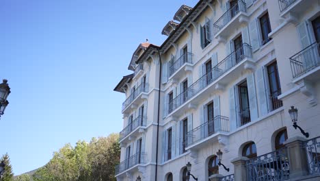 Hotel-Palace-de-Menthon-side-in-Annecy-French-Alps-in-daytime,-Wide-looking-up-shot