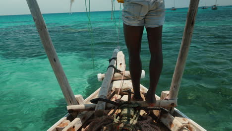 Traditional-dhow-from-stern,-clear-tropical-waters
