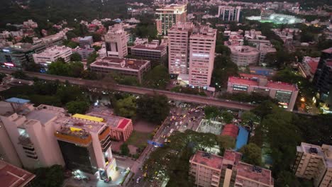Aerial-Footage-Of-Bengaluru-Metro-Track-Through-The-City-In-Busy-Traffic-Area-Filled-With-Cars