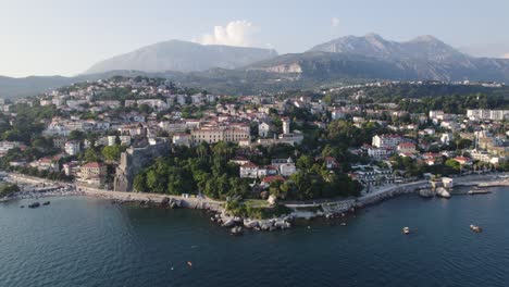 Panorama-of-coastal-town-Herceg-Novi-in-Bay-of-Kotor,-Montenegro,-mountain-range-Orjen