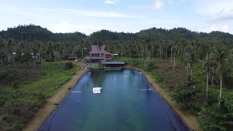 Cable-wake-park-of-Siargao-with-Artificial-Wakeboarding-Lake-amid-hills-of-tropical-palm-forest