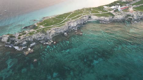 Aerial-of-Isla-Mujeres-Mexico-Riviera-Maya-Cancun-travel-holiday-destination-drone-above-Caribbean-Sea-ocean-coral-reef