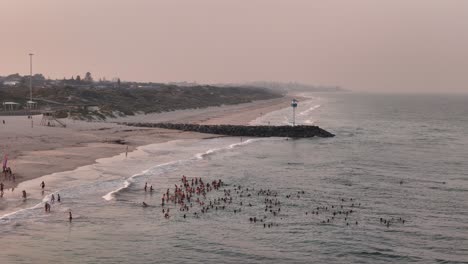 Group-of-Perth-community-going-for-a-sunrise-cold-water-swim-at-City-Beach