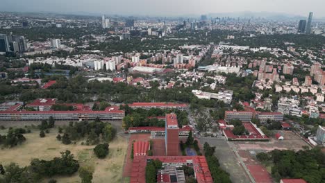 Vista-Desde-Drones-De-La-Ciudad-Universitaria-Y-El-Amplio-Paisaje-Urbano-De-La-Ciudad-De-México