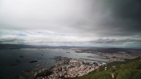 Storm-clouds-flowing-over-Gibraltar,-aerial-view