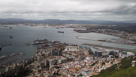 City-and-harbor-view-from-Gibraltar-rock,-aerial