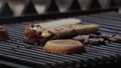 Slow-motion-footage-of-a-chef-starting-to-cook-a-grilled-sandwich-with-mustard-sauce,-and-a-meat-hamburger