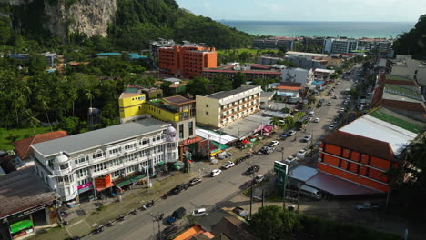 Coastal-town-of-Ao-Nang-with-afternoon-traffic,-aerial-view