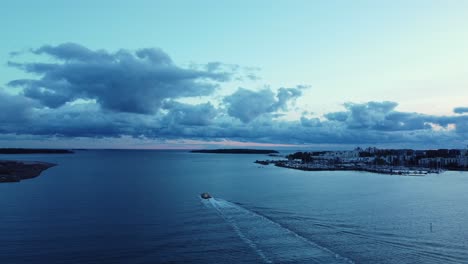 Lone-ferry-ship-departs-port-of-Helsinki-at-dawn-on-blue-Baltic-Sea