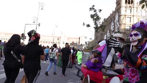 Pan-movement-over-an-organ-grinder-woman-dress-up-as-a-traditional-mexican-'catrina