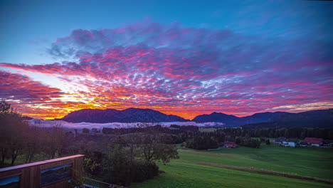 Time-lapse-of-sunrise-clouds-and-fog,-moving-over-the-countryside-of-Salzkammergut