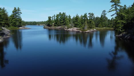 Grundy-Lake-Provincial-Park,-serene-lake-surrounded-by-pine-trees,-Canada