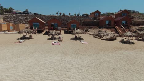 A-man-and-woman-lying-under-the-shade-on-the-beach-in-Batroun