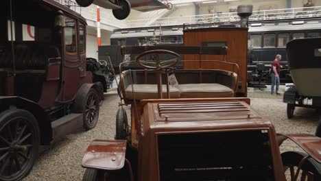 an-exhibition-of-vintage-automobiles,-offering-a-display-of-very-old-cars-from-different-eras-in-National-Technical-Museum-in-Prague,-Czech-Republic