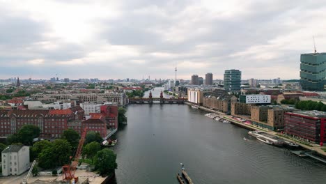 Experience-the-magic-of-Berlin's-skyline-and-iconic-Oberbaum-Bridge-from-a-bird's-eye-view-as-a-drone-gracefully-glides-over-the-Spree-River