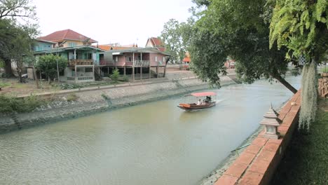 Tourists-Aboard-a-Longtail-Boat-Explore-the-Historic-City's-Canals-in-the-Ancient-City-of-Ayutthaya