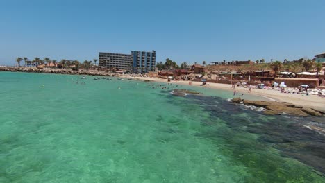 Batroun-Lebanon-Beach-resort-in-summer-sunshine-FPV-Aerial