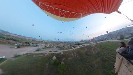 balloon-trip-over-cappadocia-turkey,-valleys-and-rocks,-capadocia