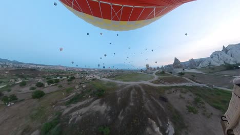 balloon-trip-over-cappadocia-turkey,-valleys-and-rocks,-tour