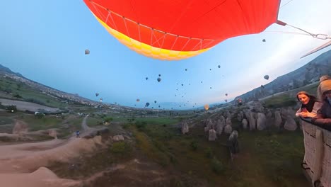 balloon-trip-over-cappadocia-turkey,-valleys-and-rocks,-turquia