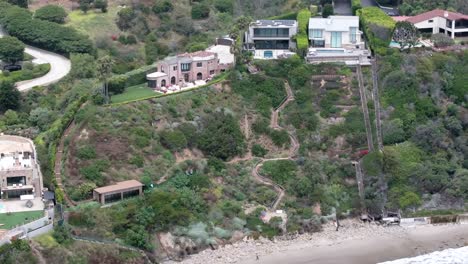 Multi-million-dollar-beachfront-mansions-in-Malibu-Hills---pullback-aerial-reveal