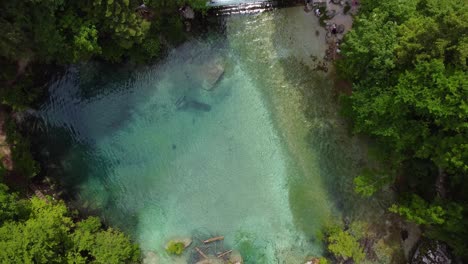 Aerial-look-down-to-a-pure-gorge-of-Kamniska-Bistrica,-popular-tourist-attraction-in-Slovenia