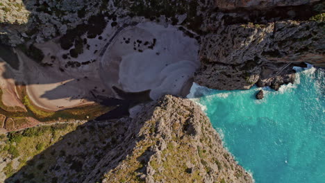 Sa-Calobra-Beach-With-Turquoise-Seascape-In-Mallorca,-Spain---aerial-top-down