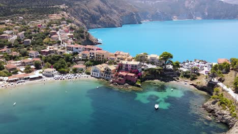 Mediterranean-hotel-resort-on-picturesque-Greek-peninsula,-aerial-orbit-summer