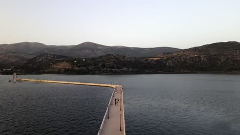Famous-Bosset-bridge-connection-Argostoli-city-bay-in-Greece,-aerial-forward
