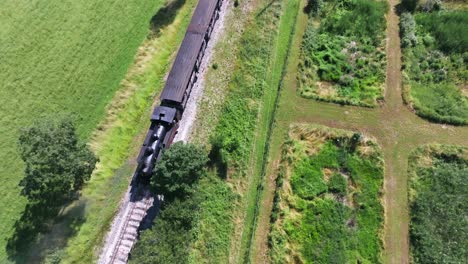 Overhead-view-of-a-steam-locomotive-on-a-railway-at-Martel,-Lot,-France