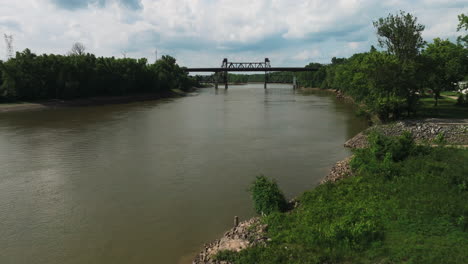 Bridge-Over-White-River-In-Twin-City-Riverfront-Park,-Arkansas,-USA---aerial-drone-shot