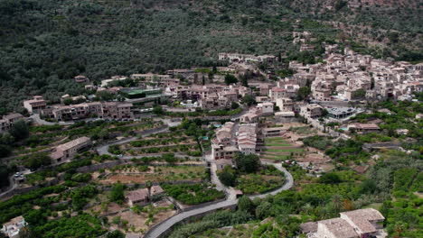 Fornalutx-Mountain-Village-In-Mallorca,-Spain---aerial-drone-shot