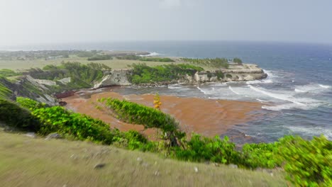 Rugged-cliffs-of-Barbados-east-coast,-revealing-drone-shot
